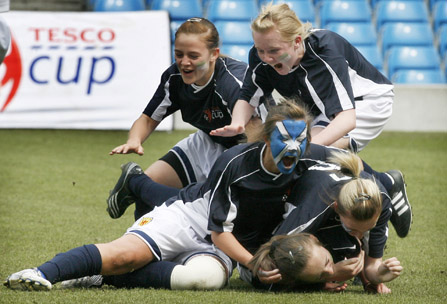 Scotlands U15 Girls team celebrate victory in their final of the Tesco Cup
